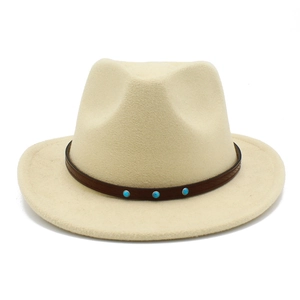 Close-up of beige wool cowboy hat with leather band and turquoise stone details