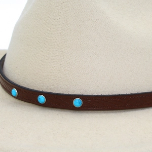 Kids vintage beige cowboy hat with embossed brown leather band and blue stone accents