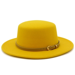 Detail view of bright yellow wool felt boater hat with slim brown leather belt and gold buckle