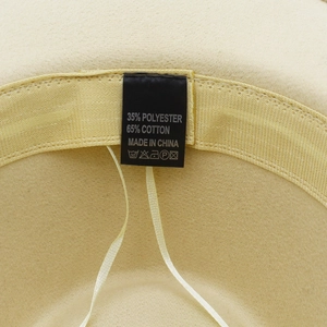 Detail view showing adjustable inner sweatband and cotton polyester material label