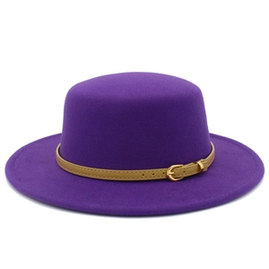 Detailed macro view of the dark purple wool felt fedora featuring a brown leather belt buckle