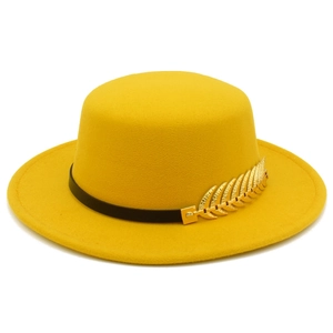 Flat top boater style yellow wool fedora hat with black band and gold leaf pin accessory