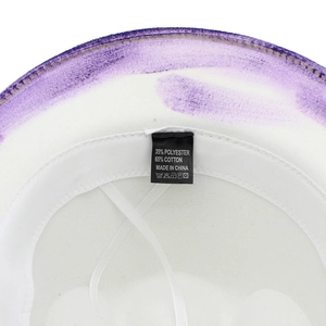 Close-up of cowboy hat interior showing the 65% cotton label and purple painted brim edge