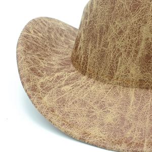 Distressed tan faux leather fedora hat with heart-shaped top and vintage stitch detail