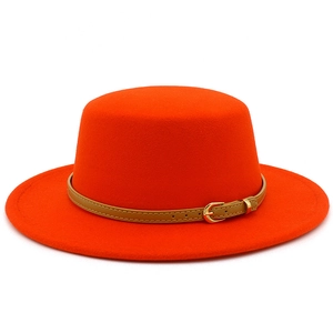Detail of orange wool boater hat featuring a khaki leather belt and gold metal buckle