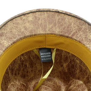 Close-up detail of vintage western hat interior showing lining and polyester label
