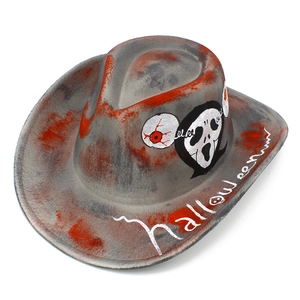 Detail of Halloween cowboy hat with ghostface mask, fake blood stains and eye patterns