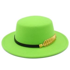 Detail view of neon green wool felt boater hat with black leather band and gold feather pin