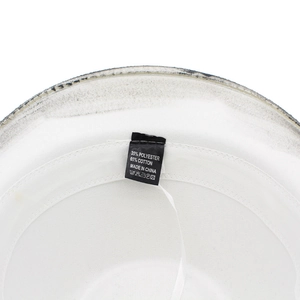 Detail view of cotton blend fabric and care label inside a white western cowboy hat