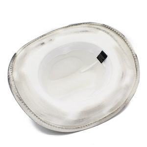 Detail view of white cowboy hat interior showing 65% cotton fabric and sweatband