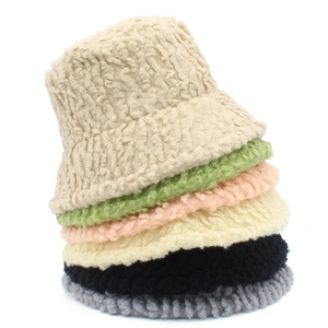 Vertical stack of plush faux lambswool bucket hats in six various pastel colors