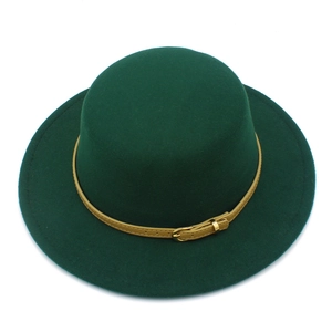 Top view of dark green wool felt boater hat with thin tan leather belt and gold buckle