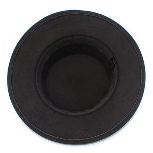 Detailed top-down view of black flat top wool fedora with interior sweatband and label