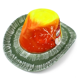Overhead view of festive cowboy hat with orange gradient crown and snowman pattern detail