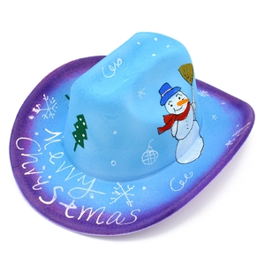 Close-up of Merry Christmas lettering and snowman print on blue cowboy hat