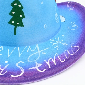 Close-up of the blue-purple gradient felt hat with Merry Christmas print and snow details