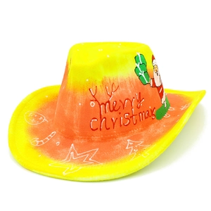 Detail of western cowboy hat with merry christmas text and festive hand-painted patterns