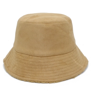 Detailed view of camel faux suede bucket hat with reinforced stitching and fleece lining