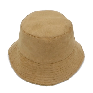 Close-up of camel suede bucket hat with parallel stitching and warm fleece lining