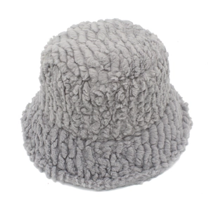 Close-up of gray faux fur bucket hat featuring unique thick wave texture and plush material