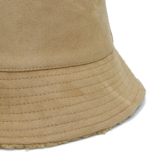 Detail view of khaki bucket hat showing suede texture, plush lining, and stitched brim