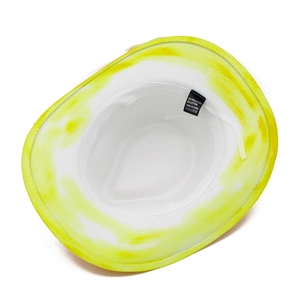 Detail view of tie-dye cowboy hat interior showing white drawstring and material label