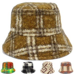 Close-up of winter bucket hats showing plaid patterns and warm fuzzy wool texture
