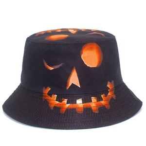 Double-sided Halloween bucket hat featuring orange pumpkin face prints on black canvas fabric