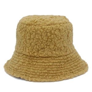 Detail of khaki lamb wool bucket hat featuring thick plush texture and reinforced stitching