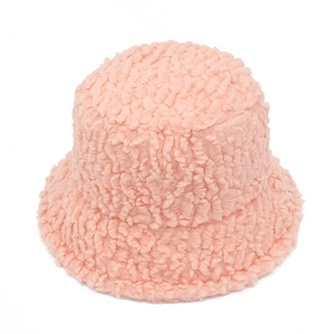 Close-up of pink faux lamb wool bucket hat showing thick plush texture and warm material