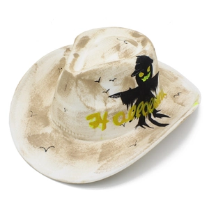 Detail of white Halloween cowboy hat with scarecrow prints and brown distressed vintage effects