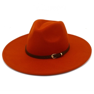 Detail of orange wool fedora hat featuring a wide brim and brown leather belt with gold buckle