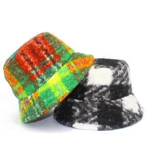 Winter faux fur plaid bucket hats in colorful gradient and black white checkered patterns