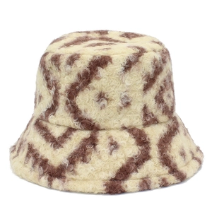 Close-up of plush teddy fleece bucket hat featuring brown and beige rhombic patterns