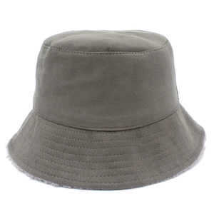 Green lamb wool bucket hat with warm faux fur lining and stylish wide brim design
