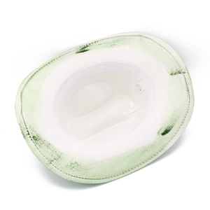 Detail of the cream cowboy hat interior showing 100% polyester label and green distressed brim
