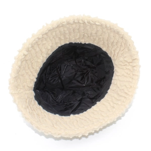 Detail view of the warm lamb wool bucket hat with black quilted lining for winter