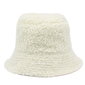 Detailed texture of soft off-white faux fur plush bucket hat with a cozy feel