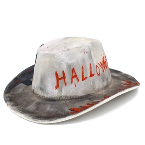 Detailed close-up of white cowboy hat with red blood splatters and Halloween text design