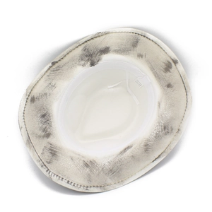 Internal detail of white cowboy hat showing 65% cotton blend fabric and sweatband