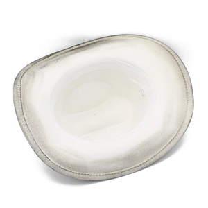 Detail view showing inner sweatband and product label of a white wide-brim fedora hat