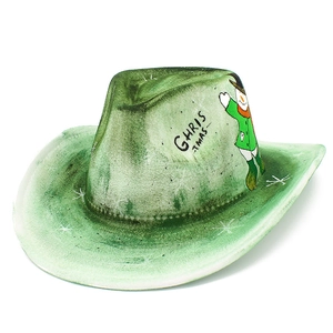 Macro detail of a green felt Christmas cowboy hat with snowman and artistic print