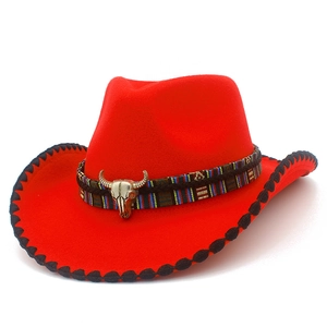 Red western felt cowboy hat with ethnic striped band and vintage bull skull accessory
