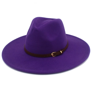 Detailed macro view of deep purple wool felt fedora with thin brown leather buckle band