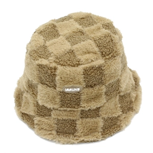 Detail of checkered faux lamb wool bucket hat with an oval stitched IMMUNE logo patch