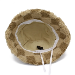 Detail view of checkerboard fleece bucket hat featuring soft inner lining and adjustable drawstrings