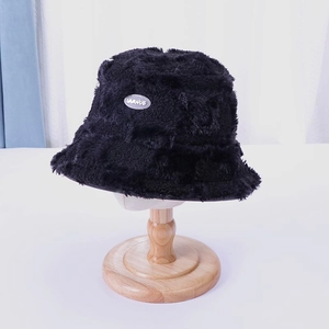 Furry checkerboard fisherman hat in black plush faux fur with stylish IMMNUE metal label