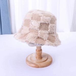Fashionable beige and brown checkerboard faux fur bucket hat with warm plush texture