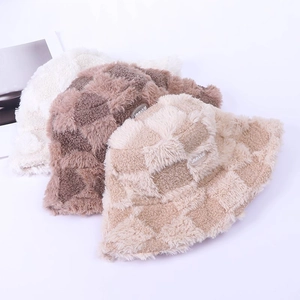 Plush checkerboard bucket hats in white, brown and beige colors for winter warmth