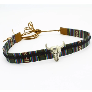 Close-up of ethnic hat band with colorful stripes and silver bull head metal ornament
